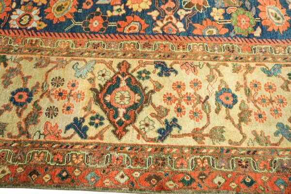 Close-up of a detailed floral border section of an antique rug by rugs on net. By rugs on net