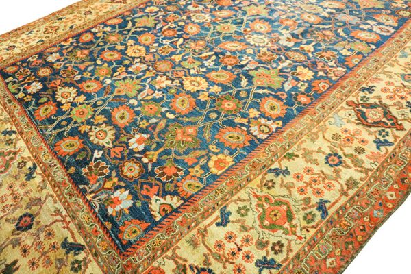 Close-up of a richly patterned blue and tan oriental rug by rugs on net. By rugs on net