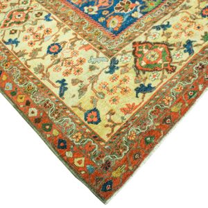 Corner detail of a cream and rust Oriental rug with blue accents by Rugs On Net. by Rugs On Net