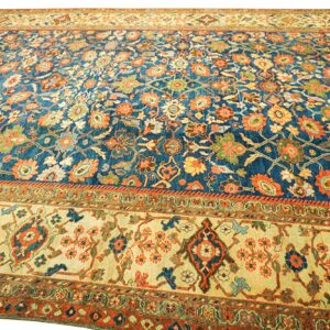 Close-up of a vibrant blue and orange floral Persian rug by Rugs On Net