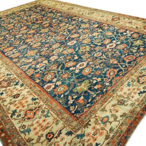 Close-up view of a vintage blue and beige Oriental rug with intricate floral patterns, by Rugs On Net