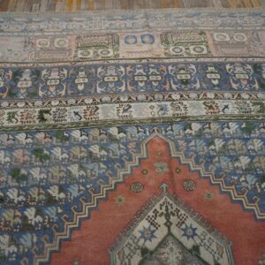 Close-up of the patterned field and border of an antique rug by Rugs On Net. by Rugs On Net