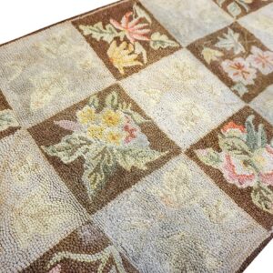 Close-up of a checkerboard rug featuring floral motifs in brown squares, by Rugs On Net. by Rugs On Net