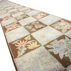 A long, narrow runner rug with a checkerboard pattern featuring floral motifs in brown and cream squares, by Rugs On Net. by Rugs On Net
