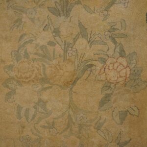 Close-up of a faded floral pattern on a beige rug by Rugs On Net