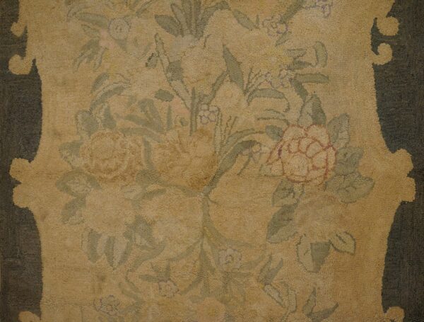 Close-up of a faded floral pattern on a beige rug by rugs on net