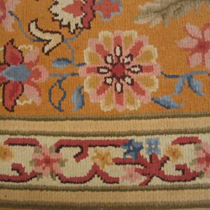 Close-up of an orange floral rug detail by Rugs On Net. by Rugs On Net