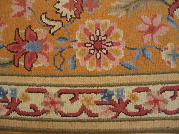 Close-up of an orange floral rug detail by rugs on net. By rugs on net