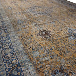 Close-up view of a gold and blue floral Persian rug by Rugs On Net. by Rugs On Net