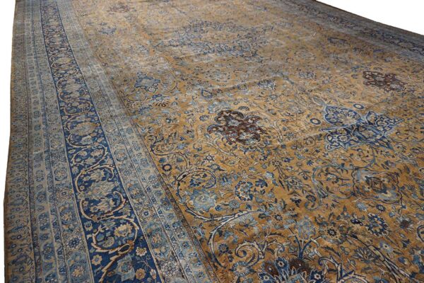 Close-up view of a gold and blue floral persian rug by rugs on net. By rugs on net