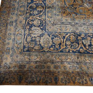 Close-up of a blue and gold Persian rug corner design by Rugs On Net