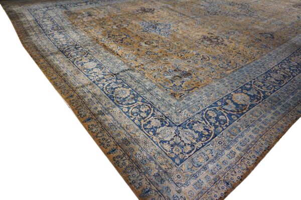 Close-up corner view of a faded blue and gold persian rug pattern by rugs on net. By rugs on net