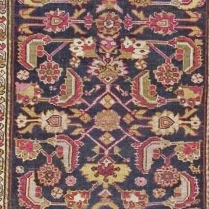 Close-up of a dark field runner rug with intricate geometric and floral motifs in deep reds and golds by Rugs On Net. by Rugs On Net