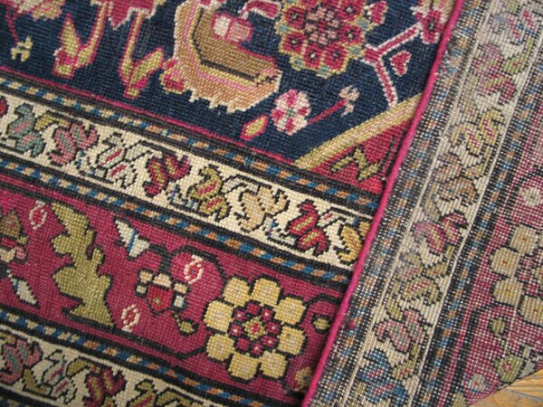 Close-up of a richly colored, intricately patterned persian rug border detail by rugs on net