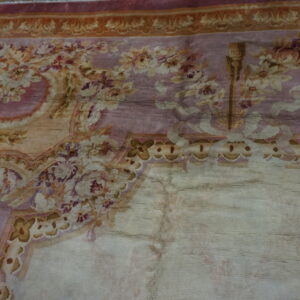Close-up of a faded floral rug with pink and gold tones by Rugs On Net