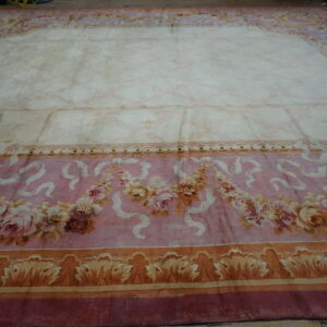 Close-up of a pink and cream floral rug with a faded center by Rugs On Net