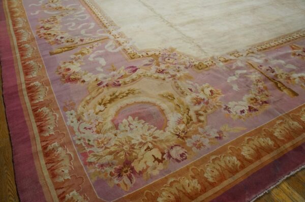 Close-up of a pink and cream floral aubusson-style rug border by rugs on net. By rugs on net