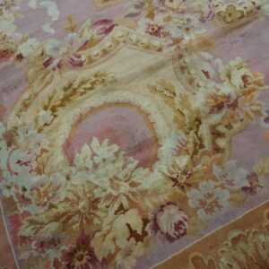 Close-up of a pink and gold floral rug detail by Rugs On Net. by Rugs On Net