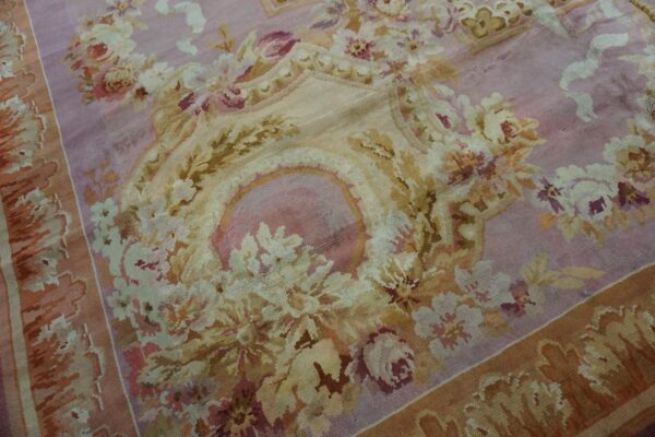 Close-up of a pink and gold floral rug detail by rugs on net. By rugs on net