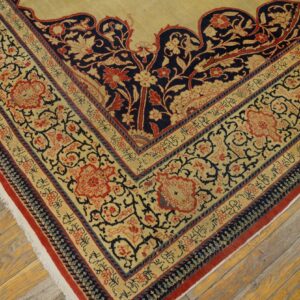 Close-up corner detail of a traditional rug with intricate floral and vine patterns in red, navy, and cream, by Rugs On Net. by Rugs On Net