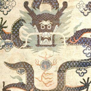 Close-up of a dragon motif on an antique rug by Rugs On Net