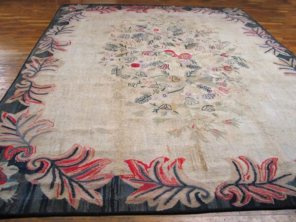 Close-up of a light-colored rug with scattered floral motifs and a bold border, by rugs on net