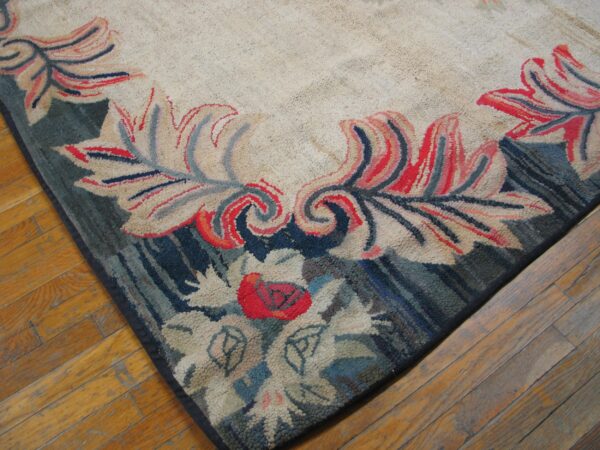 Close-up of a floral border on a beige rug with red and blue accents by rugs on net. By rugs on net