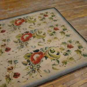 Close-up of a floral needlepoint rug with red poppies on a light background, by Rugs On Net