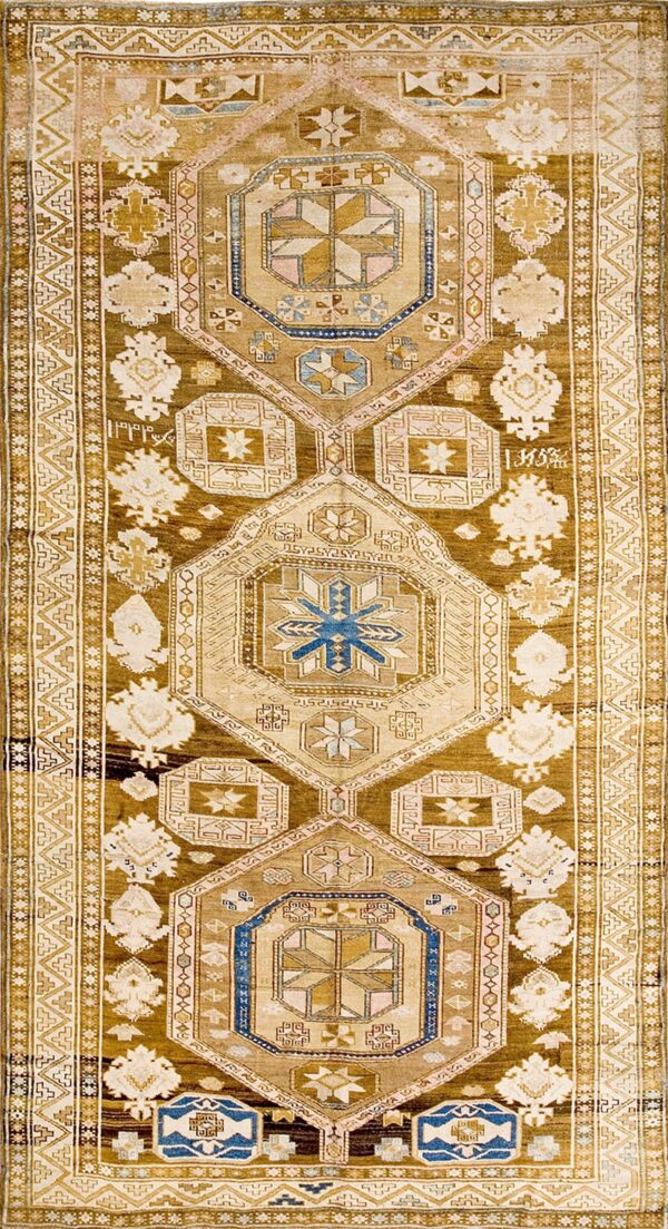 Oversized green wool karabagh featuring stylized palmette motifs and stepped zigzag border carpet by rugs on net