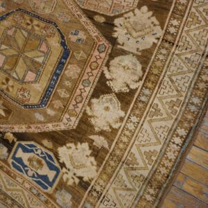 Close-up of an antique brown and tan geometric rug pattern by Rugs On Net. by Rugs On Net