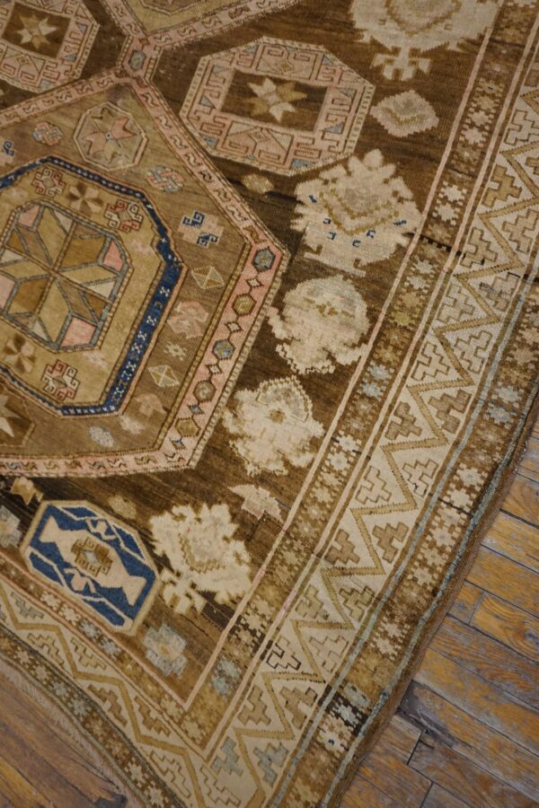 Close-up of an antique brown and tan geometric rug pattern by rugs on net. By rugs on net