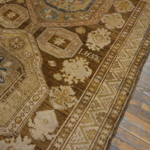 Close-up of a brown and beige geometric rug with blue accents by Rugs On Net