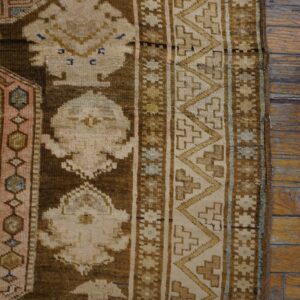 Close-up of a brown and beige geometric pattern on an antique rug by Rugs On Net. by Rugs On Net