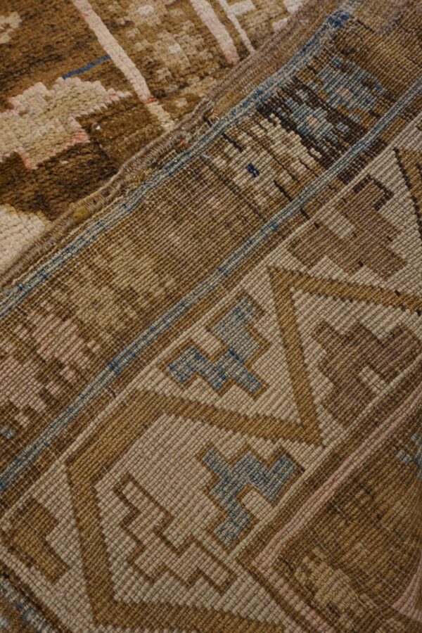 Close-up of the geometric pattern and texture of the brown kilim rug by rugs on net. By rugs on net