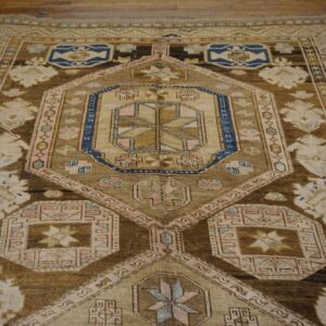 Close-up view of a geometric brown and beige rug pattern by Rugs On Net