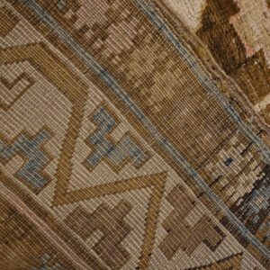 Close-up of geometric brown and tan pattern on a rug by Rugs On Net