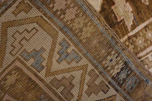 Close-up of geometric brown and tan pattern on a rug by rugs on net