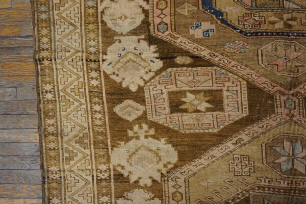 Close-up of a brown and cream geometric rug detail by rugs on net. By rugs on net