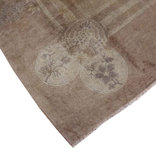 Close-up corner view of the subtle floral design on the brown vintage rug by rugs on net. By rugs on net