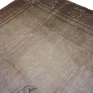 Close-up view of a faded, neutral-toned area rug with subtle border details by Rugs On Net. by Rugs On Net
