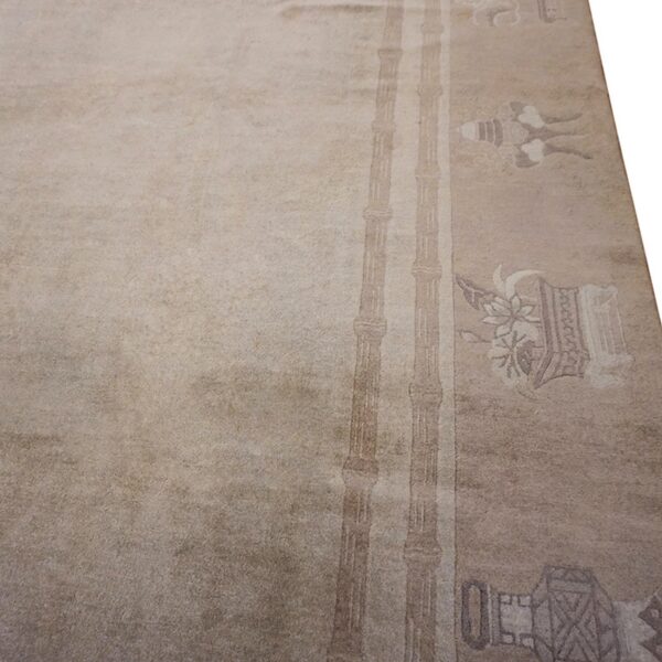 Close-up of a beige rug border featuring subtle bamboo motifs by rugs on net. By rugs on net