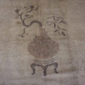 Faded, sepia-toned depiction of a vase with flowering branches on a rug by Rugs On Net