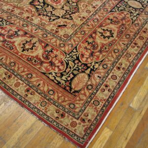 Corner detail of a red and beige Oriental rug with intricate floral borders by Rugs On Net. by Rugs On Net