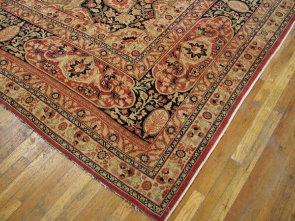 Corner detail of a red and beige oriental rug with intricate floral borders by rugs on net. By rugs on net