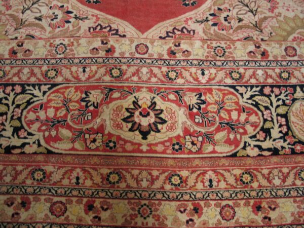 Close-up of a floral border design on a traditional rug by rugs on net. By rugs on net