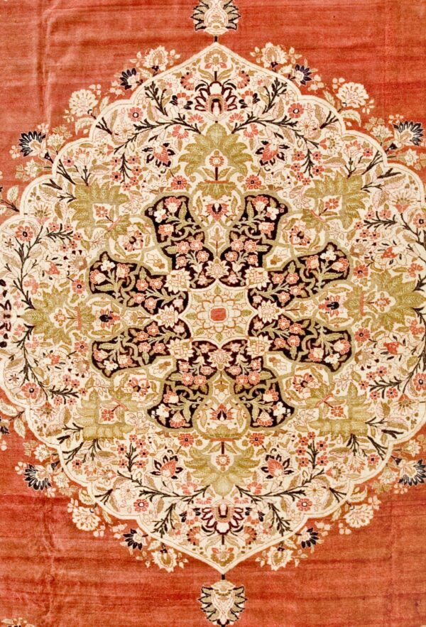 Close-up of a richly detailed floral medallion design on a rust-colored rug by rugs on net. By rugs on net