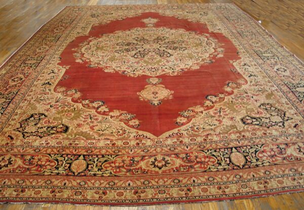 Large antique persian rug with a red field and intricate floral borders by rugs on net