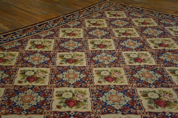 Close-up of a floral needlepoint rug with blue and brown accents by rugs on net