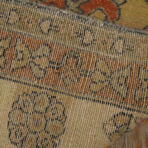 Close-up of the woven texture and border pattern of a beige and rust rug by Rugs On Net. by Rugs On Net