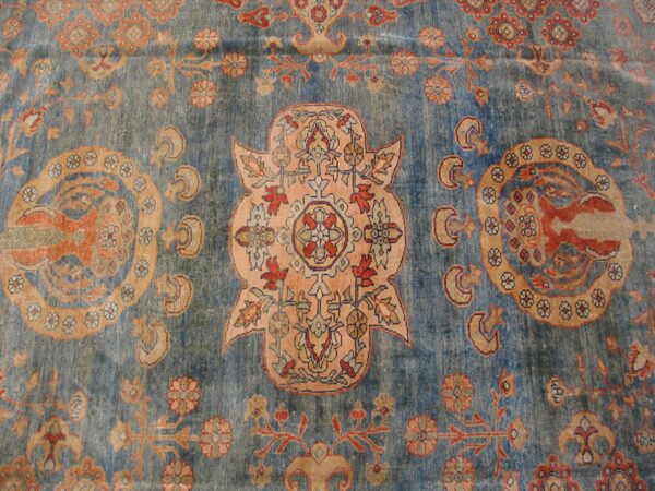 Close-up of a blue and coral patterned rug detail by rugs on net